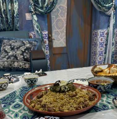 A platter of Fergana plov at a Chaikhana (tea house or casual restaurant). My guide, driver, and I shared.