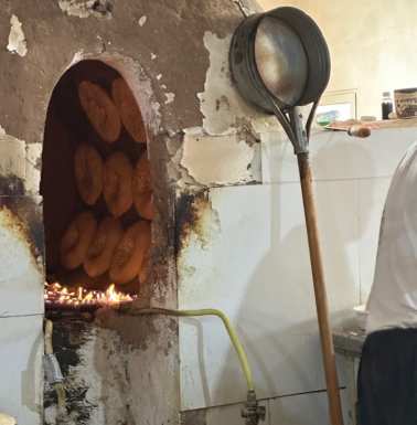 Bread baking on oven walls.