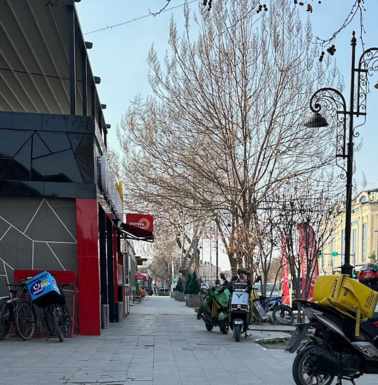 Fast food central near the hotel, with ubiquitous delivery bikes.