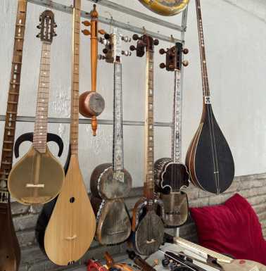 Traditional instruments in a trading dome with small versions for children on the top row.